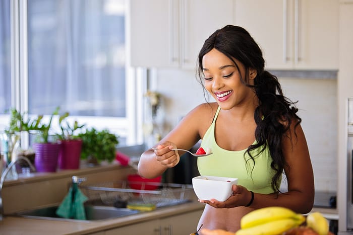 A woman eating a healthy breakfast